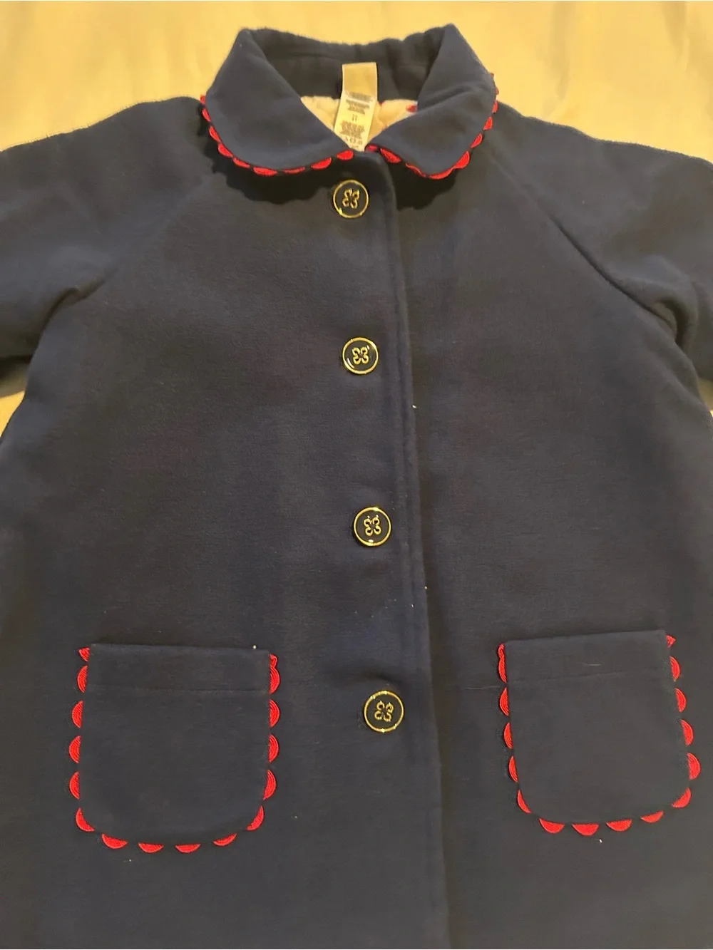 Little Me Navy Pea Coat with Red Scallop Trim and Bow.